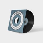 A record is on the side of a blue box.