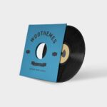 A record is sitting on top of the woothemes logo.