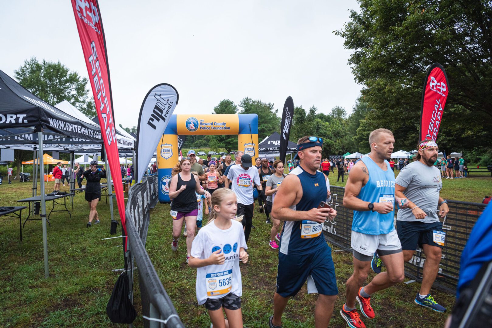 A group of people participating in a Police Pace race.