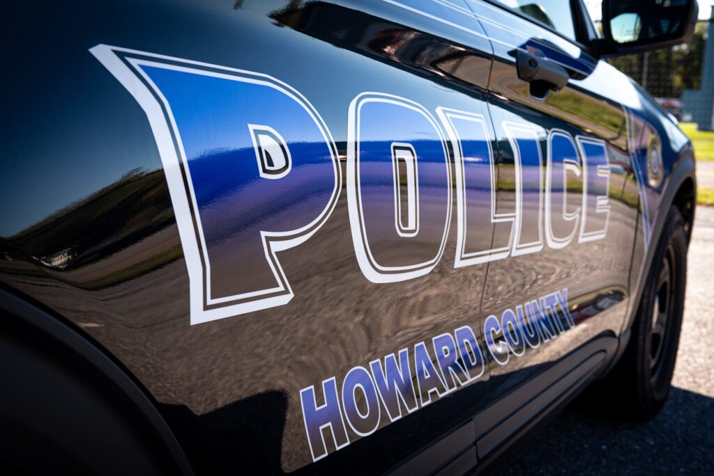 Howard county police car parked in a parking lot during the Police Pace 5K.