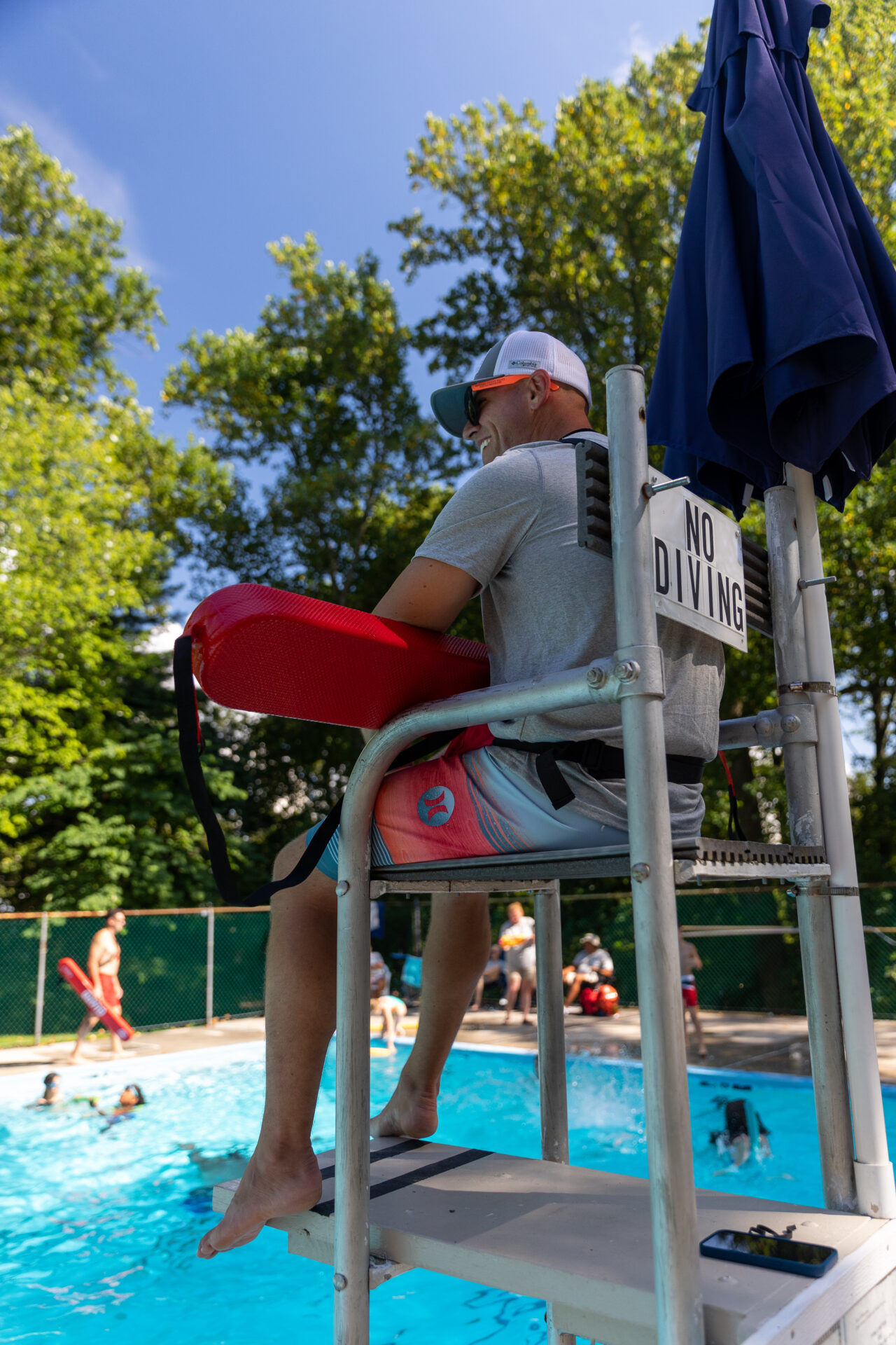 A BearTrax-equipped man on a lifeguard stand.