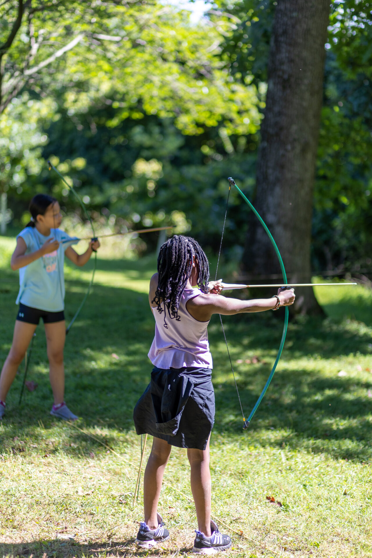 A group of girls enjoying a game of archery in BearTrax Park.
