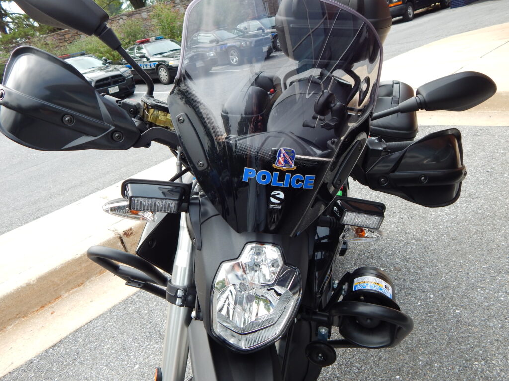 A motorcycle parked in a parking lot, possibly belonging to HCPD.