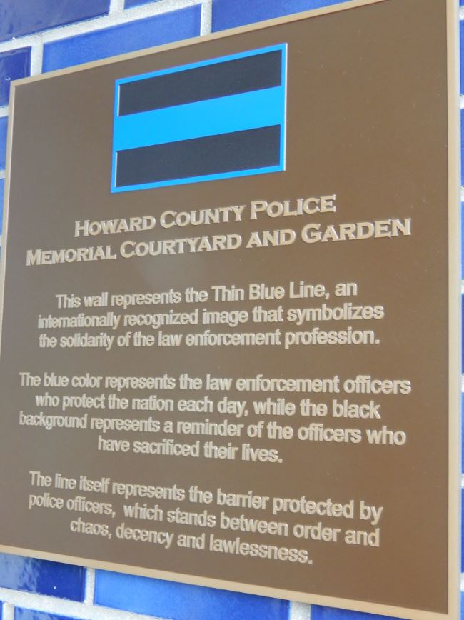 HCPD Memorial Garden is a serene courtyard dedicated to the Howard County Police Department's fallen officers. The garden provides a peaceful sanctuary for reflection and remembrance, with vibrant blue flowers and lush greenery