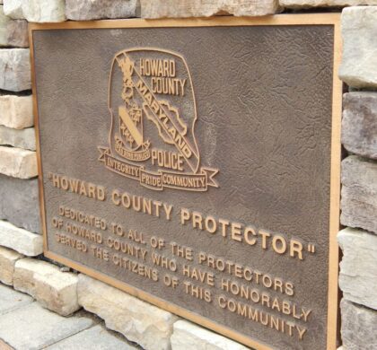 A plaque on the side of a building in the HCPD Memorial Garden that reads oconee county protector.