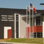 Howard County Public Safety Training Center with flags in front.